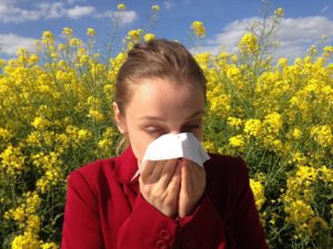 woman blowing nose