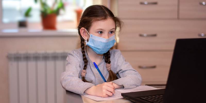 Child looking at a computer