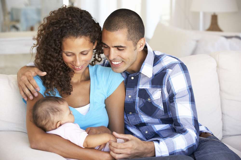 Happy mixed race family with baby