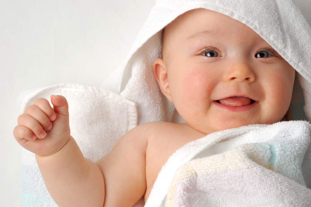 cute baby wrapped in towel