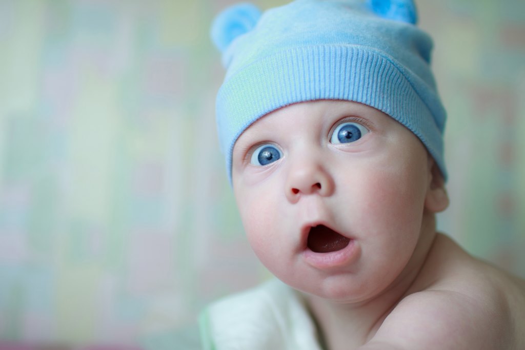 newborn baby boy with funny expression