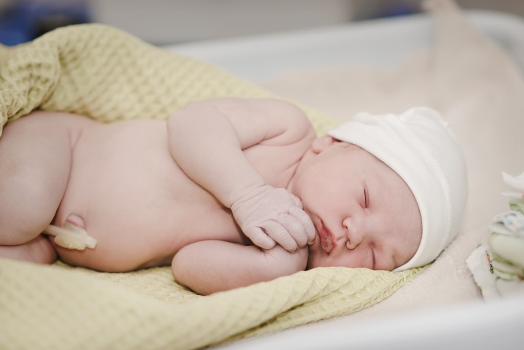 newborn baby with umbilical cord stump