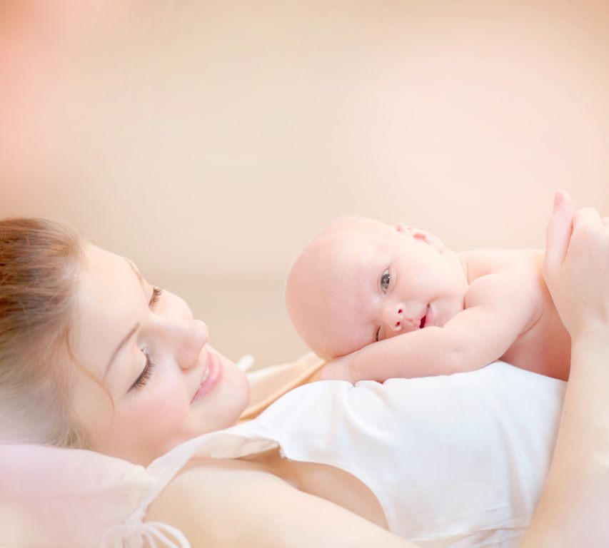 mother holding baby