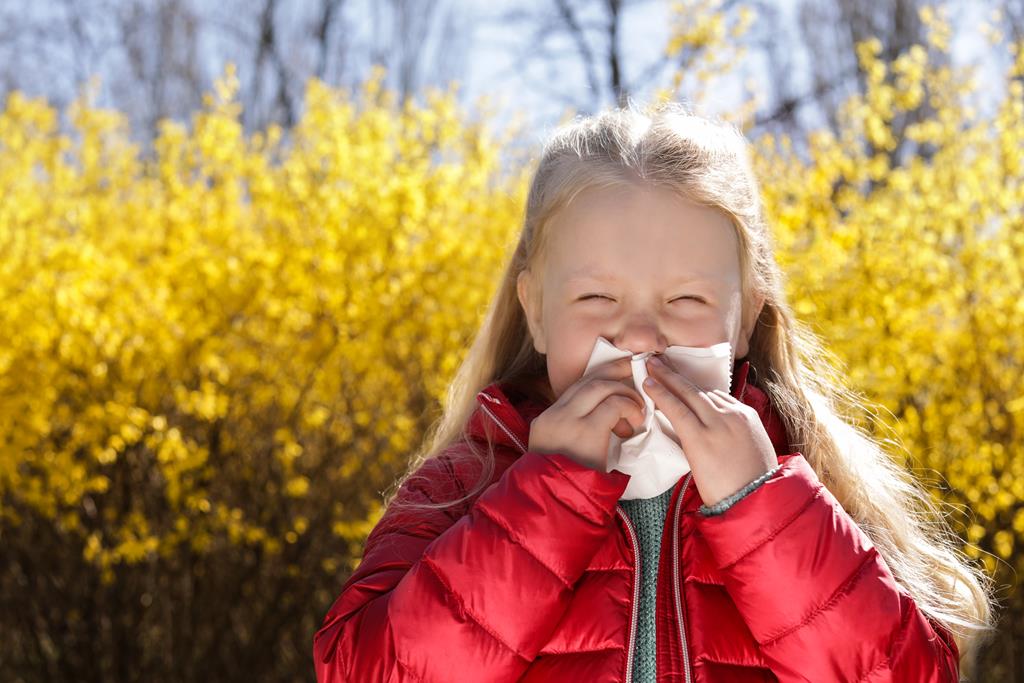 Little girl suffering from seasonal allergy outdoors, space for text