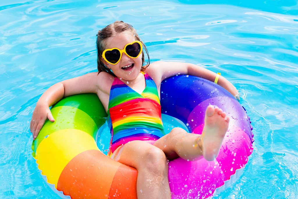 little girl playing in pool